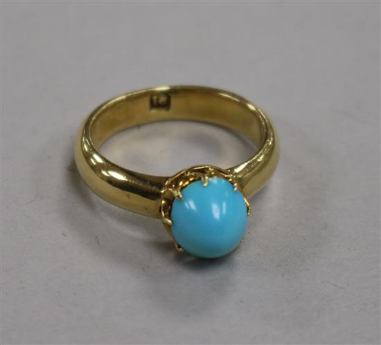 An 18ct gold and turquoise cabochon ring, 6.8g, size O.